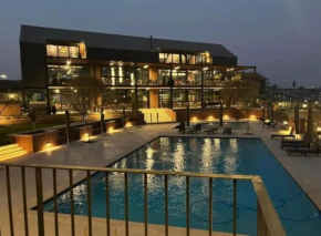 Modern Retreat in Waterfall Midrand with Lagoon, Gym, Pool & Restaurant
